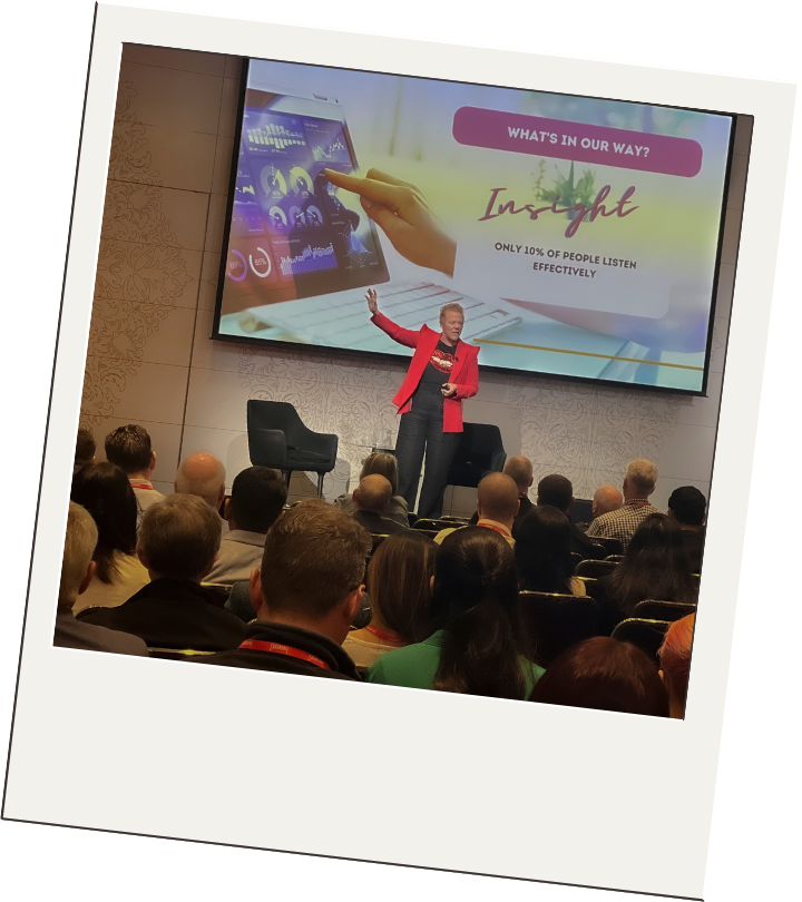 Rebecca presenting to an audience at a leadership event